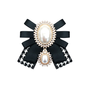 Elegant vintage bow brooch with pearls, crystals and houndstooth ribbon for women