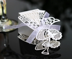 Laser-cut white wedding gift box with angel design and purple ribbon detail