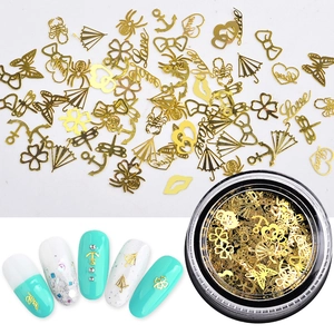 Charm's nail art dorés évidés en métal formes variées dans un pot transparent