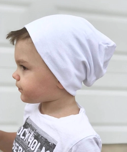Side view of white cotton slouchy beanie for children with soft knitted texture