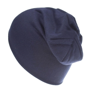 Detail of navy blue cotton knit slouchy beanie with soft texture and ribbed cuffs