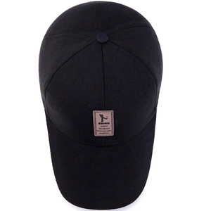 Black cotton baseball cap with a brown leather patch showing a golf silhouette