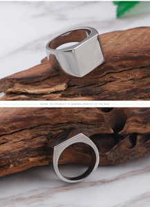 Detailed close-up of polished silver square signet ring made of durable titanium steel