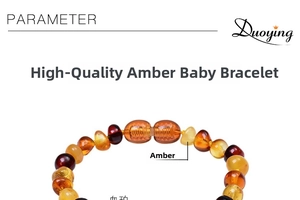 Macro shot of natural Baltic amber baby bracelet with yellow beeswax and red blood amber