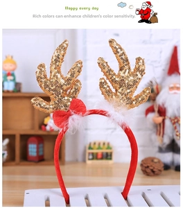 Detail of Christmas headband with golden sequin antlers, red velvet wrap and bow decoration