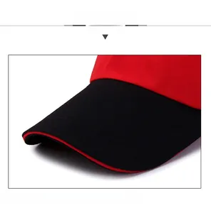 Detail view of structured baseball cap brim featuring red and black contrast sandwich layer