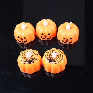 Set of 5 orange LED pumpkin candle lights with spider web and jack-o'-lantern faces