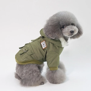 Olive green hooded dog jacket with Rock Blue label and metal leash ring on grey poodle