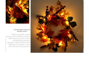 Close-up of artificial autumn maple leaf wreath with LED lights and berries decoration