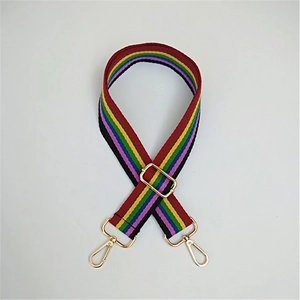Adjustable rainbow striped canvas shoulder strap with polished gold metal hardware buckles