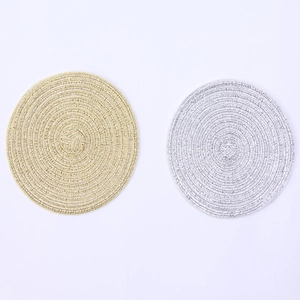 Round metallic gold and silver woven placemats with heat resistant spiral texture