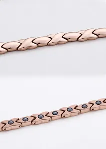 Detail of rose gold X-link bracelet showing magnetic inserts and polished finish