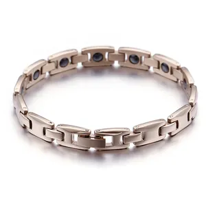 Bracelet magnétique pour femme en acier titane or rose avec design à maillons en H poli