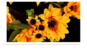 Detailed view of artificial sunflower petals and green leaves on a floral wreath