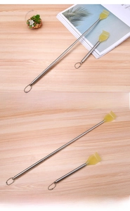 Detail of extendable stainless steel back scratcher showing retracted and expanded states