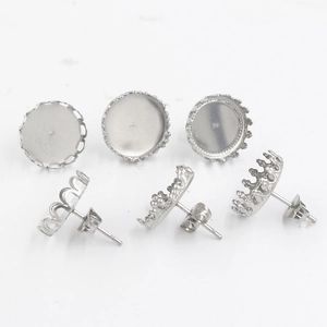 Macro shot of 12mm stainless steel crown earring posts and flat bases for DIY jewelry