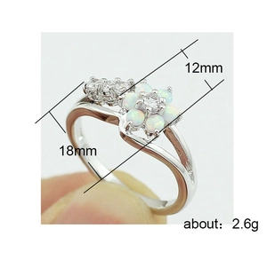 Silver flower ring with white opal petals and sparkling zircon accents for women