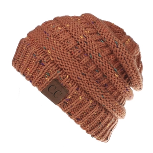 Detail of rust orange knit beanie featuring confetti speckles and a brown faux leather C.C tag