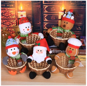 Detail of five handcrafted Christmas candy baskets with plush Santa, Snowman and Reindeer motifs