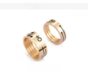 Detail of 18K gold vacuum plated couple rings with gender symbols, 8mm and 6mm width