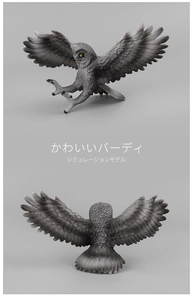 Detailed view of lifelike owl model with realistic grey feathers and spread wings