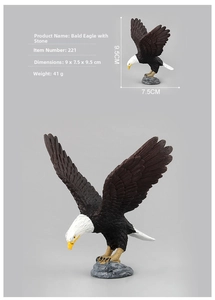 Detailed realistic bald eagle figurine on rock with 9.5cm height and 7.5cm width dimensions