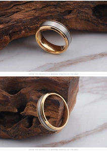 Detailed view of two-tone titanium steel ring with gold edges and brushed silver band