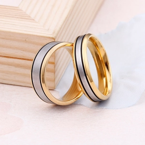 Two-tone titanium steel couple rings with brushed silver center and gold edges