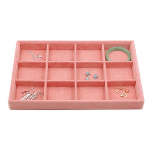 Pink velvet jewelry display tray with 12 compartments for organizing rings and earrings