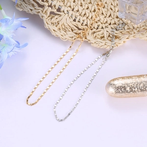 Tobilleras de playa minimalistas en oro y plata con cierre de mosquetón y cadena ajustable