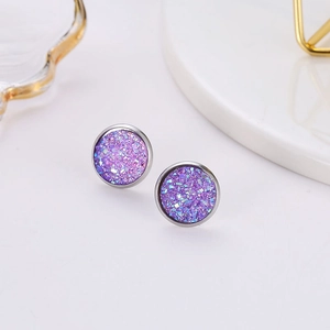 Macro shot of 12mm silver round studs featuring glittering purple mineral stone texture