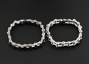 Detail view of single and double layer stainless steel bicycle chain bracelets for men