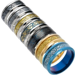 Group of stainless steel dragon rings in silver, black, gold and blue with celtic patterns