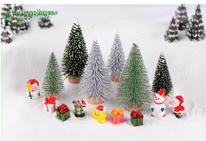 Miniature Christmas landscape set with tiny snow-dusted trees and festive resin figures
