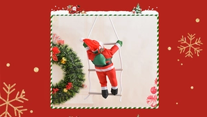 Detailed view of a Santa Claus figurine with green bag climbing a rope ladder for Christmas decor