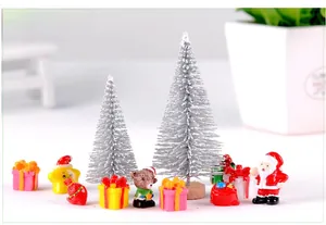 Miniature Christmas set with glittery silver trees and small holiday figurines