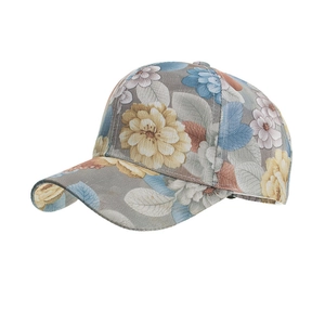 Detail view of lace flower print baseball cap with grey base and colorful floral patterns