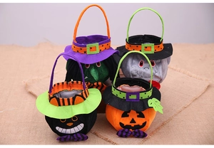 Detailed view of four felt Halloween gift bags featuring witch, ghost, cat, and pumpkin designs