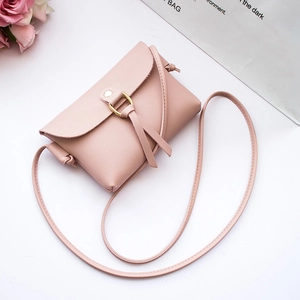 Pink mini crossbody bag for women with gold ring decor and premium PU leather finish