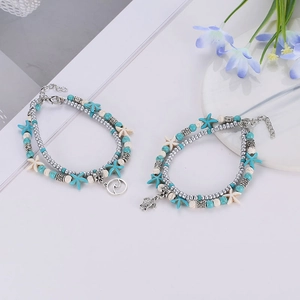 Ensemble de chevillières bohèmes multicouches avec étoile de mer et tortue turquoise et blanc