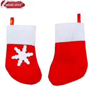 Classic red and white Christmas stocking cutlery holders with snowflake felt decor