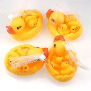 Four sets of yellow rubber duck bath toys packaged in white mesh bags for toddlers