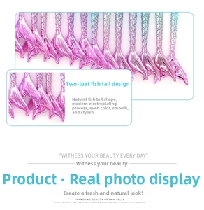 Detail of mermaid tail design makeup brush handles with pink to cyan gradient plating