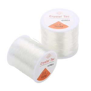 Close-up of 100M clear elastic crystal beading cord rolls in 0.8mm and 1.0mm diameter