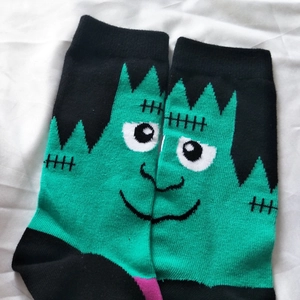 Detail of Frankenstein puzzle design on cotton blend mid-calf socks with reinforced heels