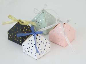 Polka dot pyramid candy boxes in black, pink, mint green and white with satin ribbons