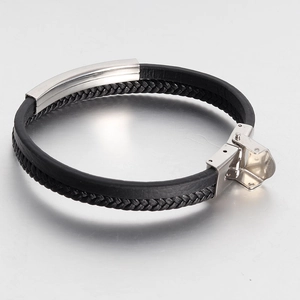 Detailed close-up of double-layer woven leather bracelet with silver metal snap clasp