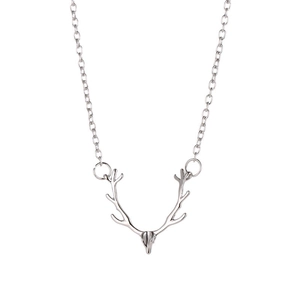 Close-up of a silver reindeer antler pendant necklace with polished metallic finish