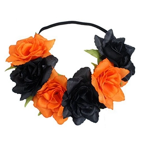 Close-up of orange and black silk rose floral elastic headband on white background