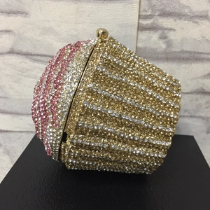 Macro detail of a cupcake-shaped evening bag with pink and gold crystal rhinestones